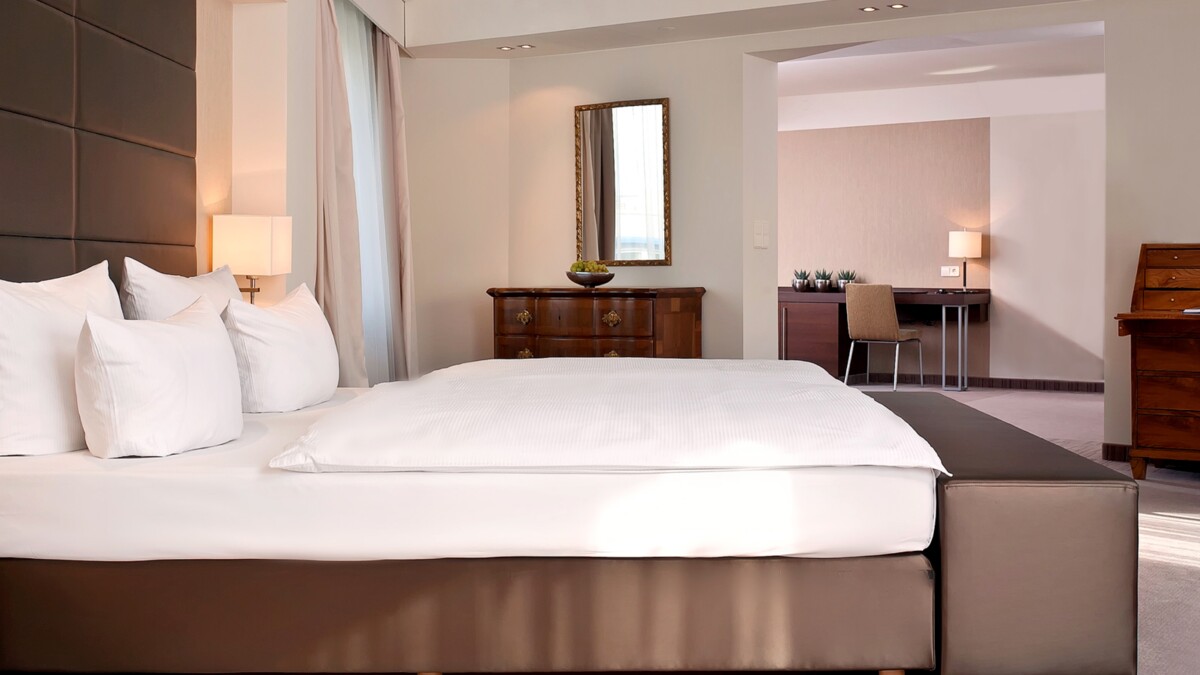 Double bed with antiques in a suite