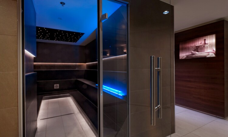 Illuminated steam sauna at the Estrel wellness area